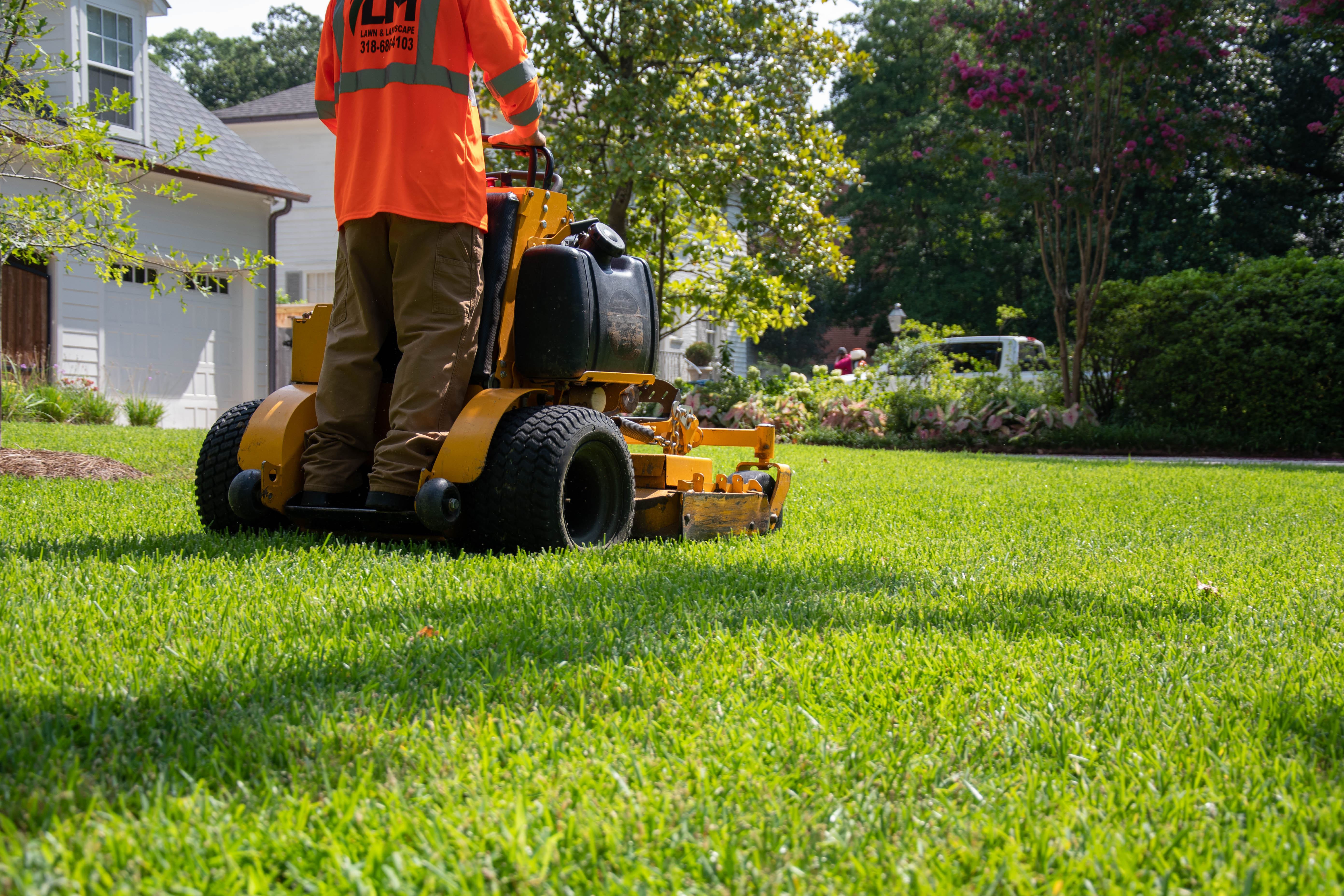 Person mowing a lawn